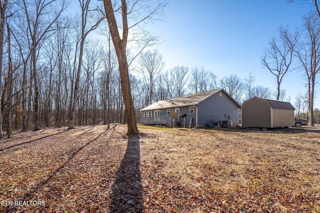 exterior space with a storage shed