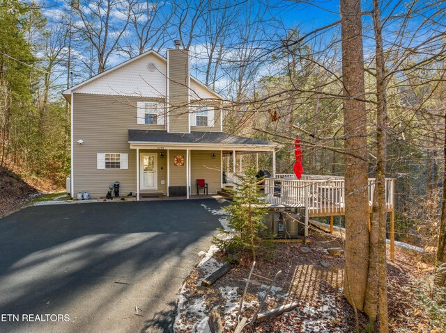 2133 Duck Pond Ln, Sevierville, TN 37876 - view of front facade featuring a wooden deck and covered porch