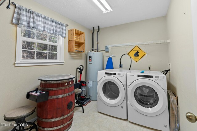 2133 Duck Pond Ln, Sevierville, TN 37876 - washroom with electric water heater and washing machine and dryer