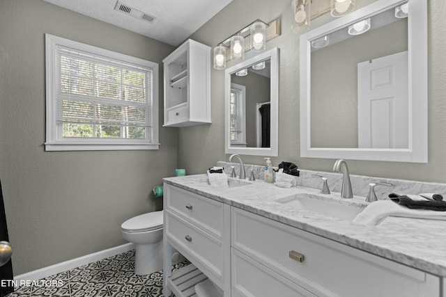 2133 Duck Pond Ln, Sevierville, TN 37876 - bathroom with tile patterned floors, vanity, and toilet