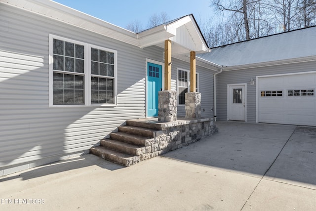 doorway to property featuring a garage