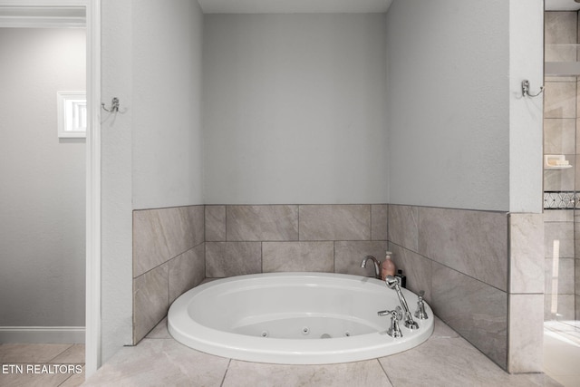 bathroom with a relaxing tiled tub