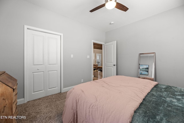 carpeted bedroom with ceiling fan and a closet