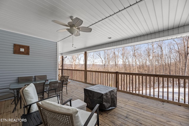 wooden terrace featuring ceiling fan