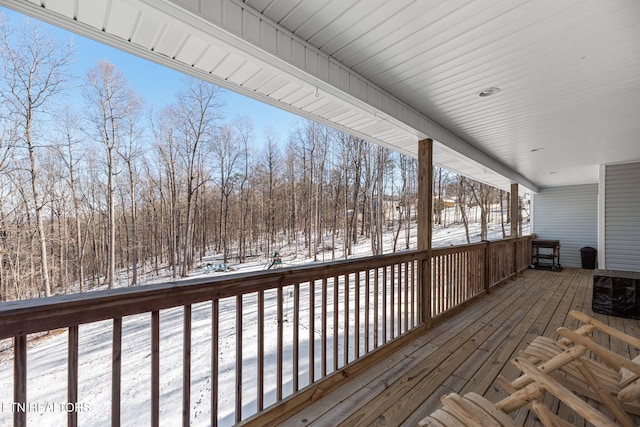 view of snow covered deck