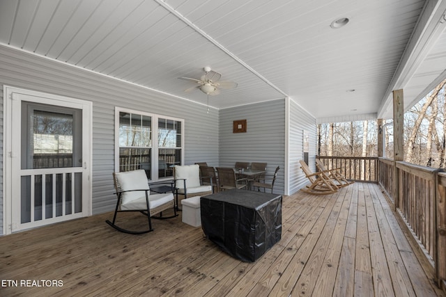 wooden terrace featuring ceiling fan