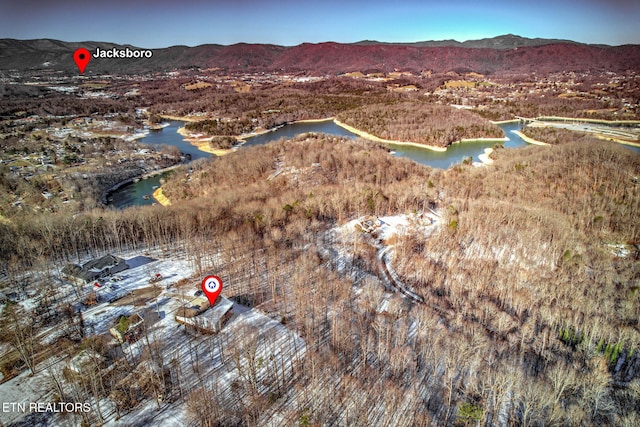 aerial view featuring a water and mountain view