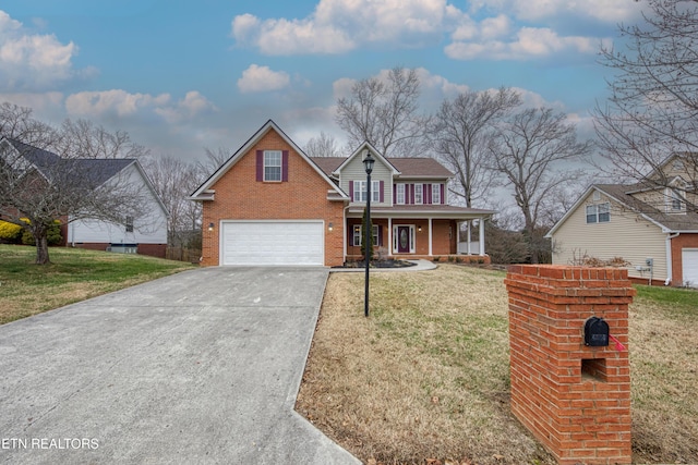 view of front property featuring a front lawn, a porch, and a garage