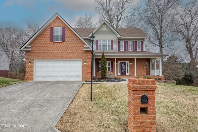 view of front of home featuring a front lawn, a porch, and a garage