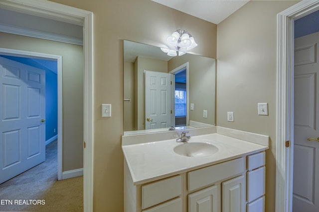 bathroom with vanity and an inviting chandelier