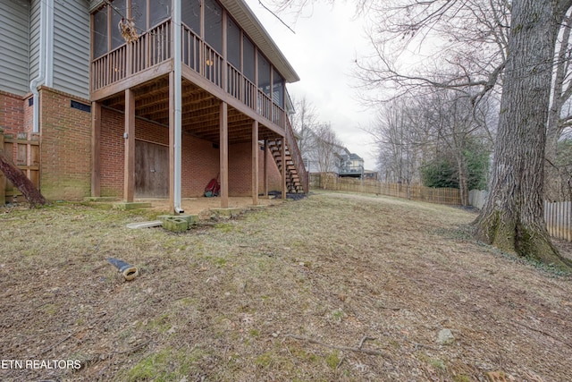 view of yard featuring a sunroom