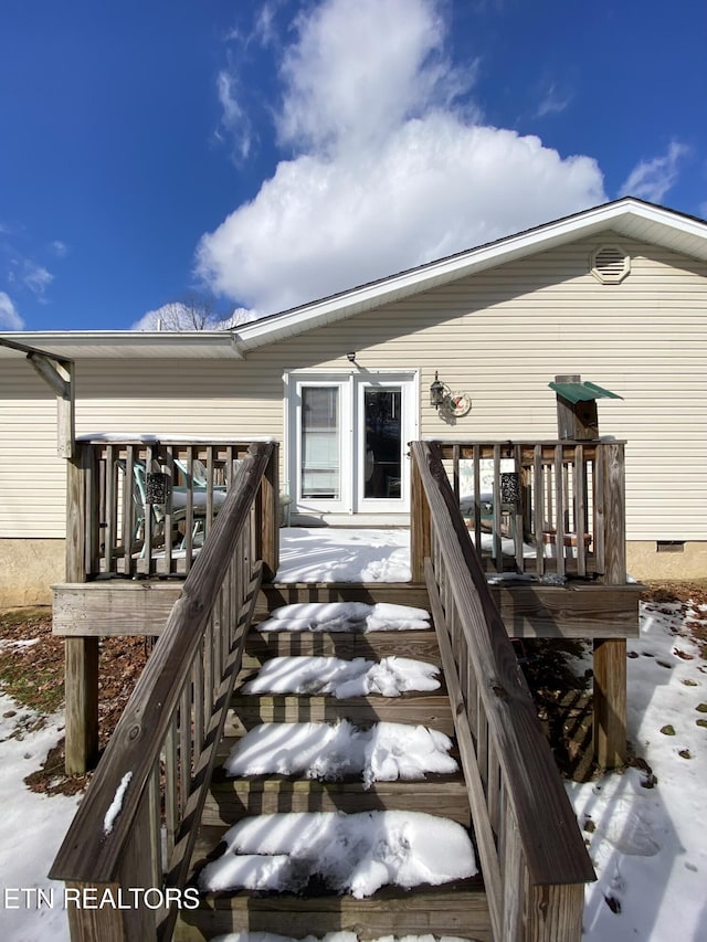 view of snow covered deck