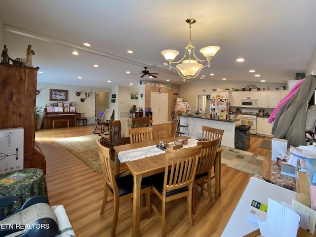 dining room featuring ceiling fan and light hardwood / wood-style flooring