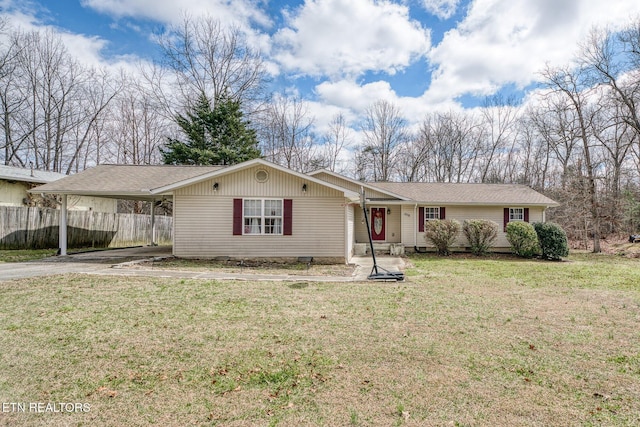 single story home featuring driveway, an attached carport, a front lawn, and fence