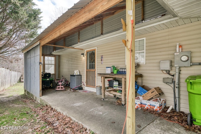 view of patio / terrace featuring fence