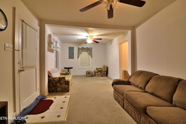 living room featuring light carpet, electric panel, and ceiling fan