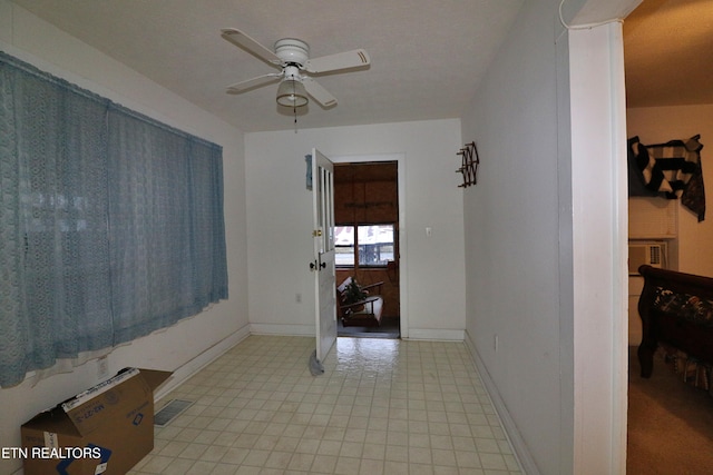 entrance foyer with ceiling fan