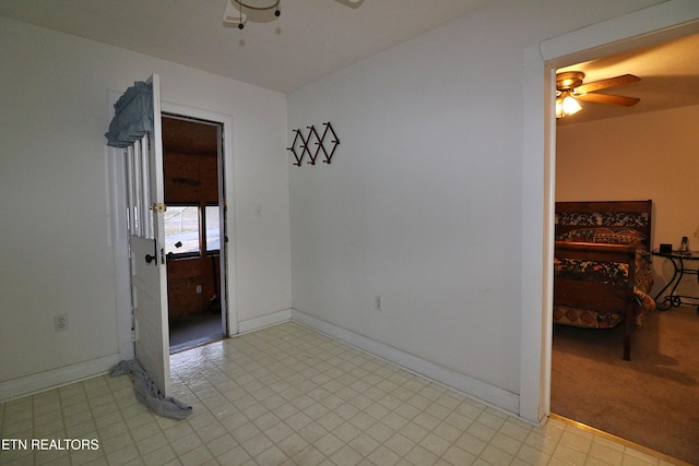 unfurnished room featuring ceiling fan