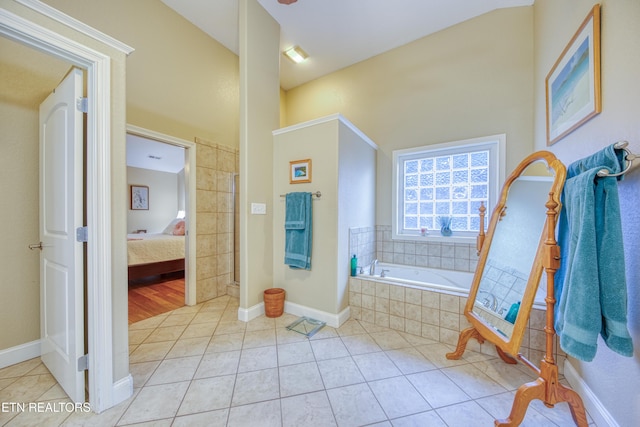 bathroom featuring tile patterned flooring and plus walk in shower