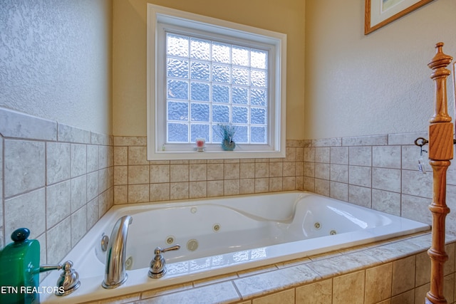 bathroom featuring a relaxing tiled tub