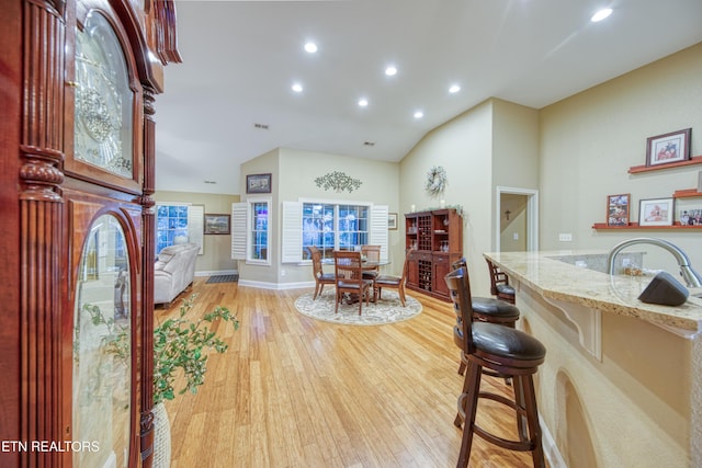 foyer entrance featuring light wood-type flooring and sink