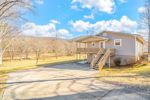 view of front of home featuring a front lawn and a porch