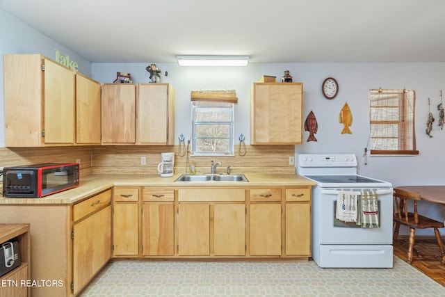 kitchen featuring light brown cabinets, backsplash, white electric range oven, and sink