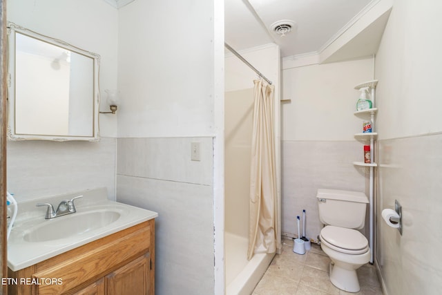 bathroom featuring toilet, a shower with shower curtain, tile patterned floors, ornamental molding, and vanity