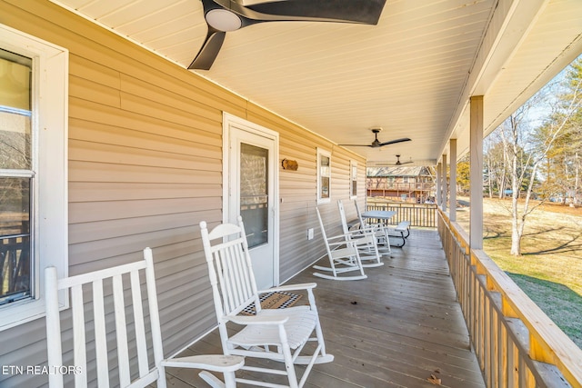 deck featuring ceiling fan and a porch