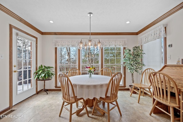 dining space with crown molding, a textured ceiling, and a notable chandelier