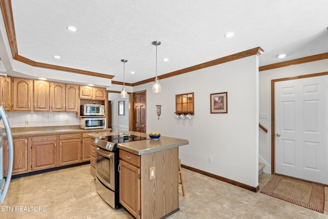 kitchen with pendant lighting, a center island, crown molding, decorative backsplash, and stainless steel appliances