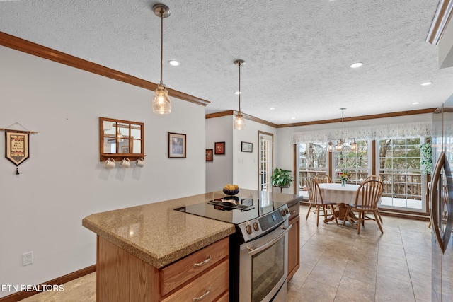 kitchen with pendant lighting, ornamental molding, a textured ceiling, and appliances with stainless steel finishes