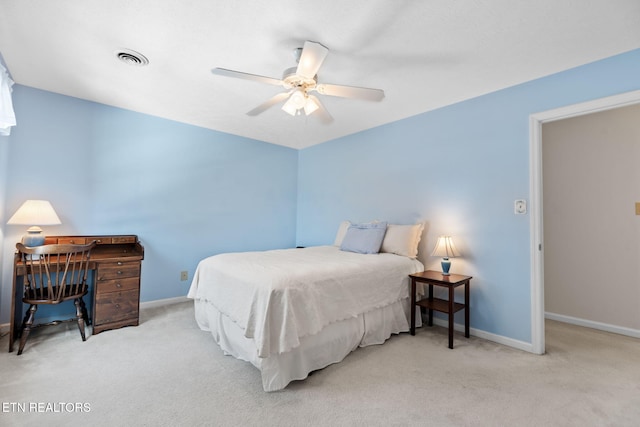 carpeted bedroom with ceiling fan