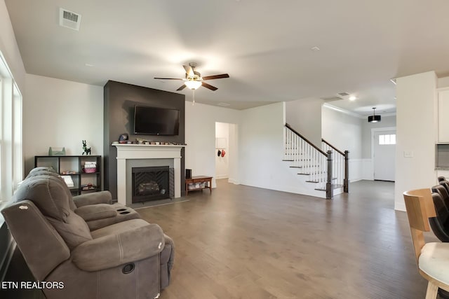 living room featuring ceiling fan and wood-type flooring