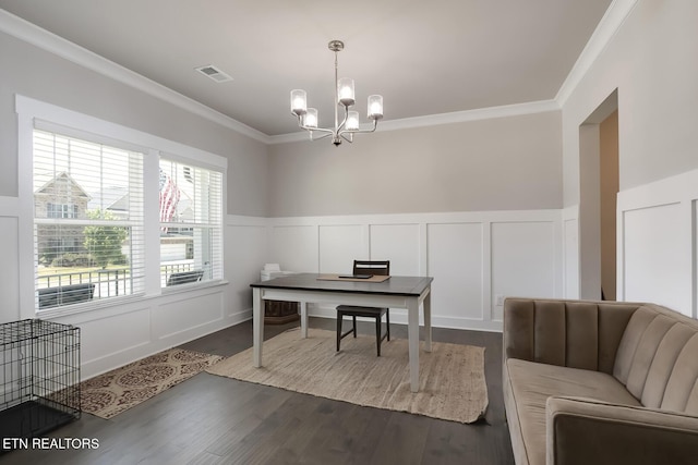 home office featuring dark wood-type flooring, an inviting chandelier, and crown molding