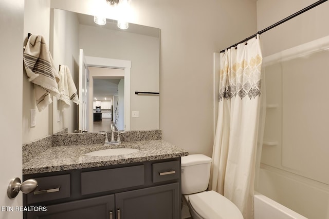 full bathroom with shower / tub combo with curtain, vanity, and toilet