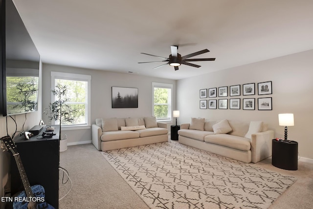 living room featuring ceiling fan and light colored carpet