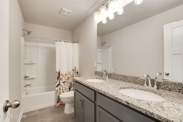 full bathroom featuring tile patterned floors, vanity, shower / tub combo, and toilet