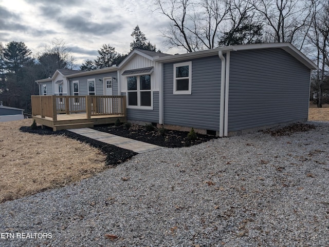 manufactured / mobile home with a wooden deck