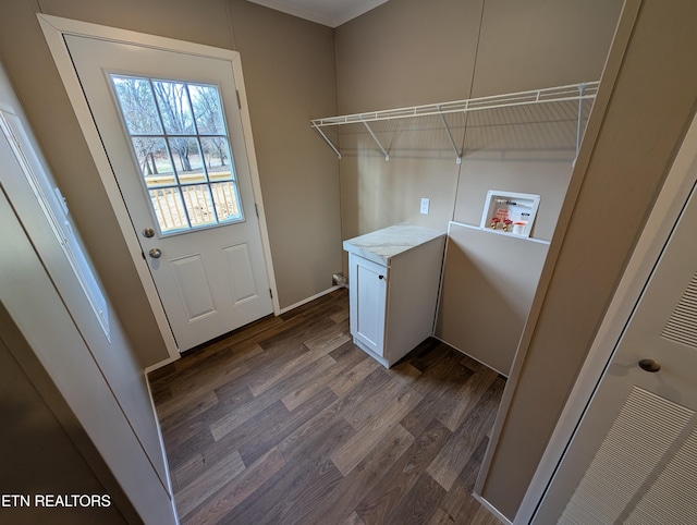 washroom featuring hookup for a washing machine and dark wood-type flooring