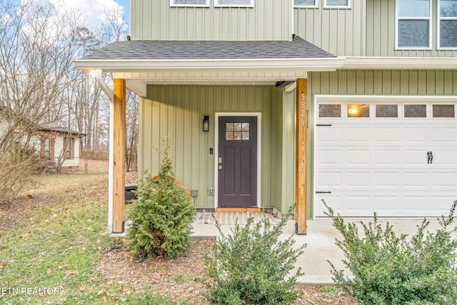 doorway to property featuring a garage