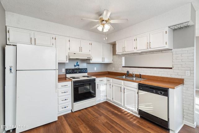 kitchen with dark hardwood / wood-style flooring, white appliances, ceiling fan, sink, and white cabinets