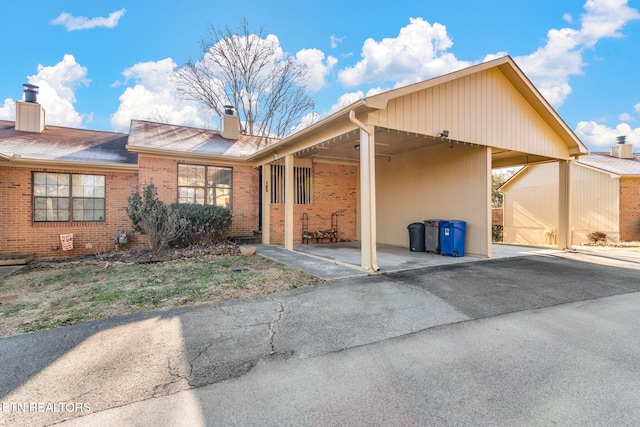 exterior space with a carport