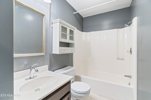 full bathroom with toilet, vanity, a textured ceiling, and washtub / shower combination