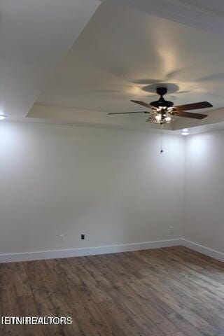 empty room featuring hardwood / wood-style flooring and ceiling fan