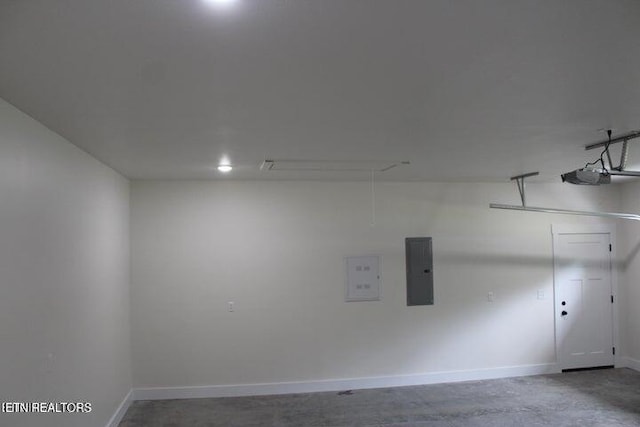 garage with a garage door opener and electric panel