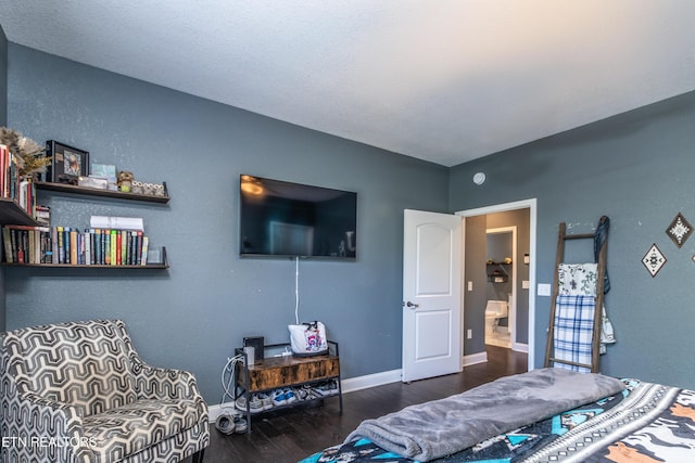 bedroom with dark wood-type flooring