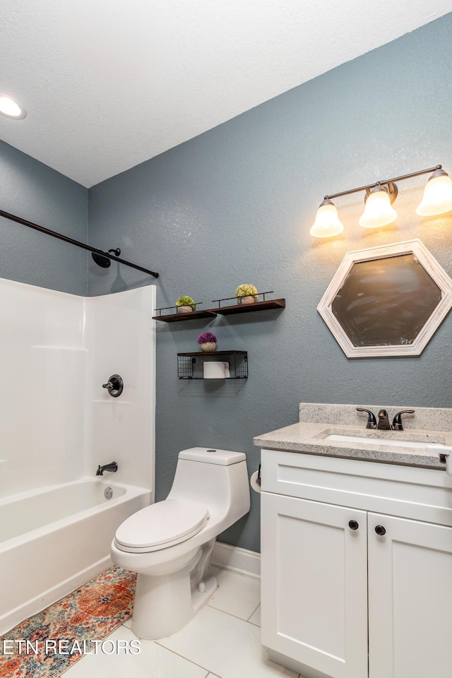 full bathroom with bathtub / shower combination, toilet, vanity, and tile patterned flooring