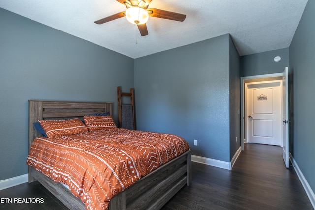 bedroom with dark wood-type flooring and ceiling fan