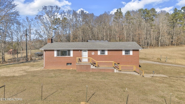 view of front of property with a front lawn